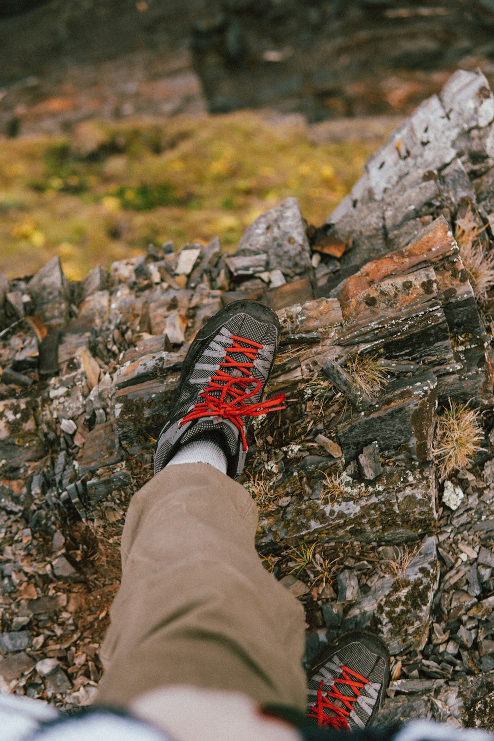 a person's feet on a rock