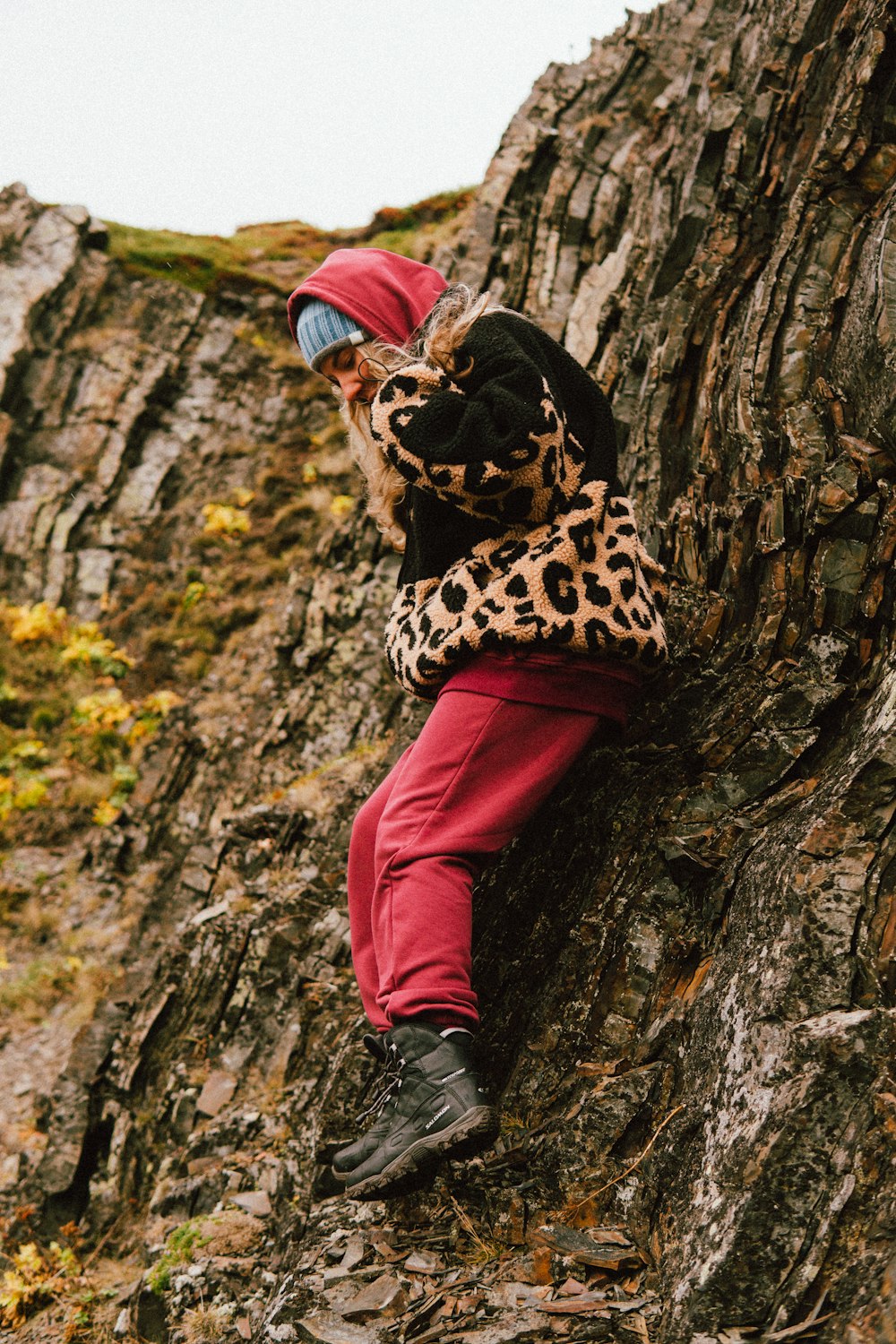 a man sitting on a rock