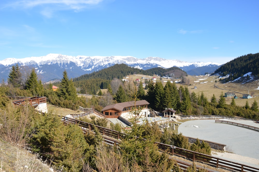 a town with trees and mountains in the background