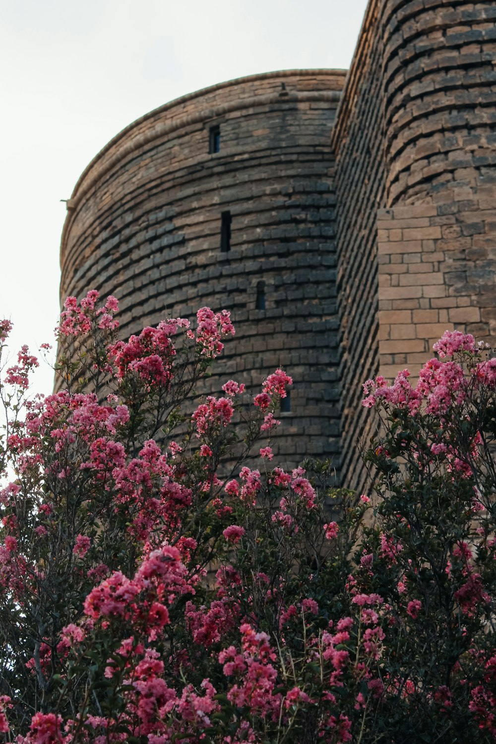 a tall brick building with a tower