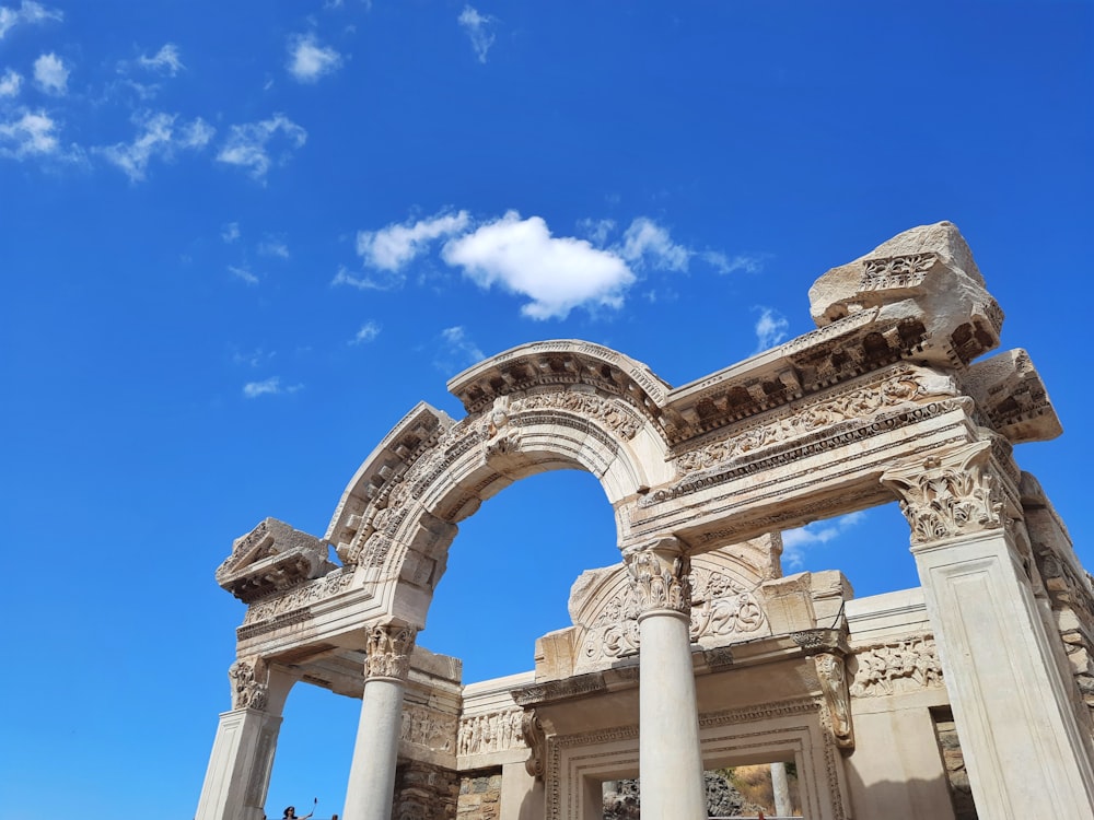 a building with columns and a blue sky