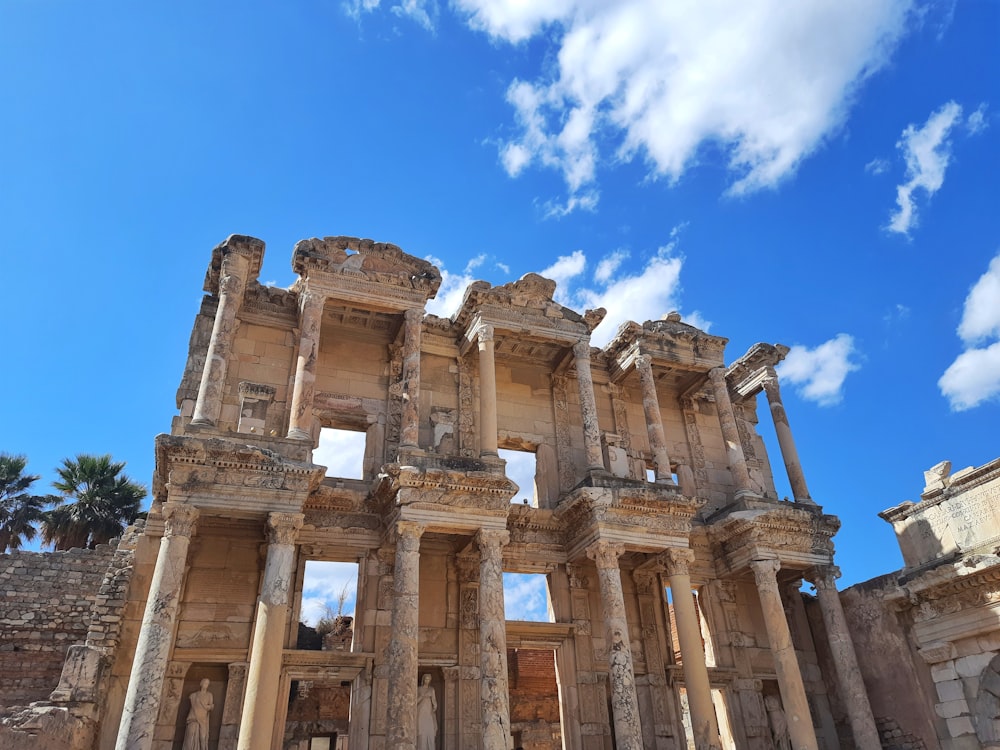 a building with columns and a blue sky