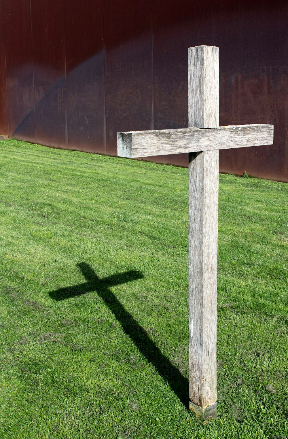 a cross on a green lawn