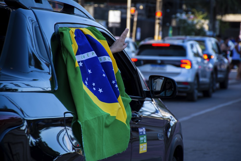 a car with a flag on the hood