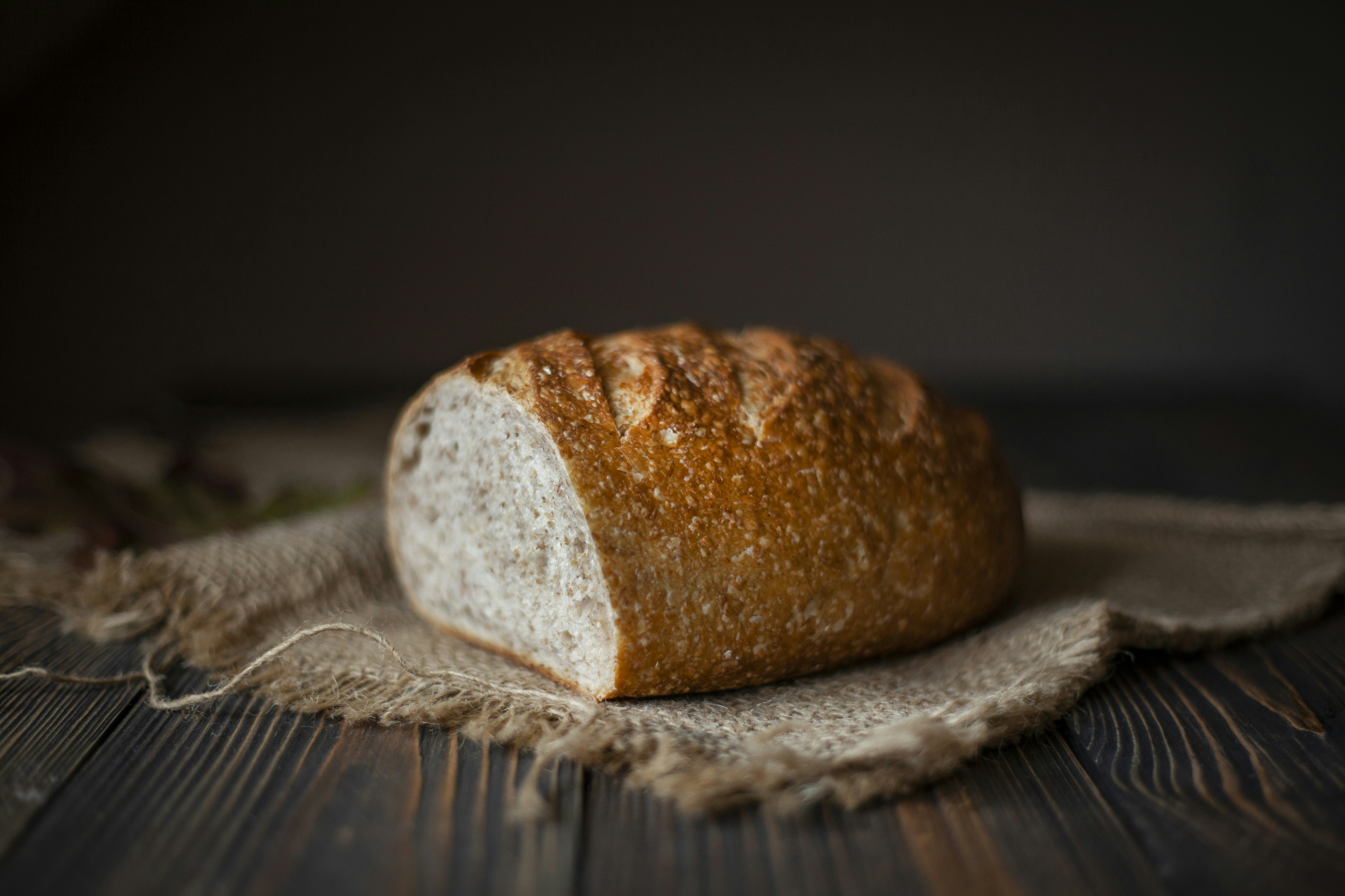 a loaf of bread on a wooden surface