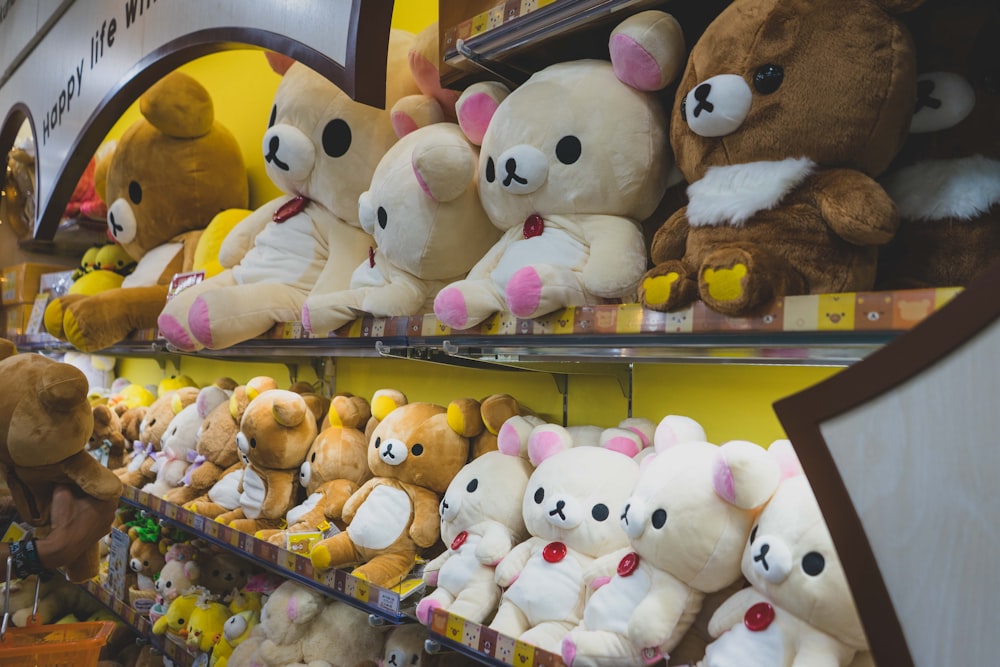 a group of stuffed animals on a shelf