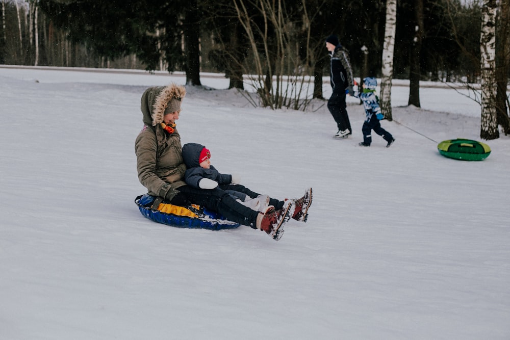 a group of people playing in the snow