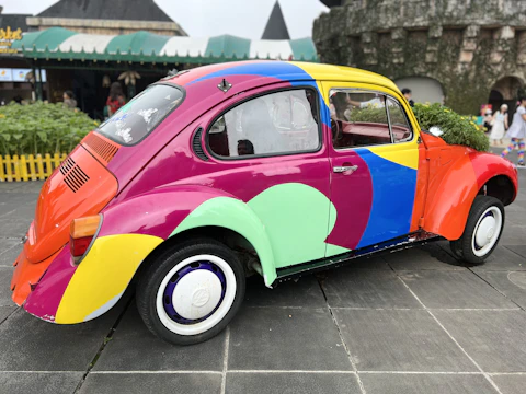 A customized Volkswagen Beetle with vibrant paint and unique interior details.
