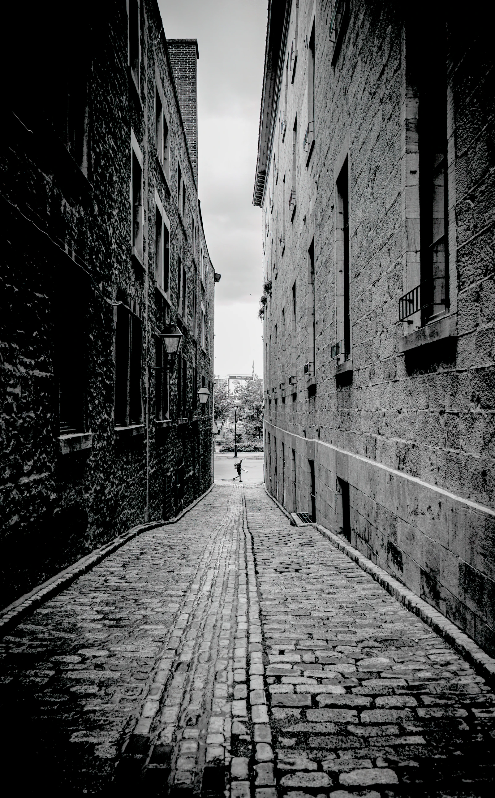Cobblestone street in Old Montréal lined with historic stone buildings