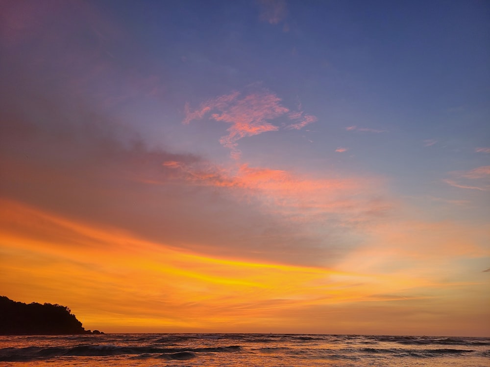 a sunset over a beach