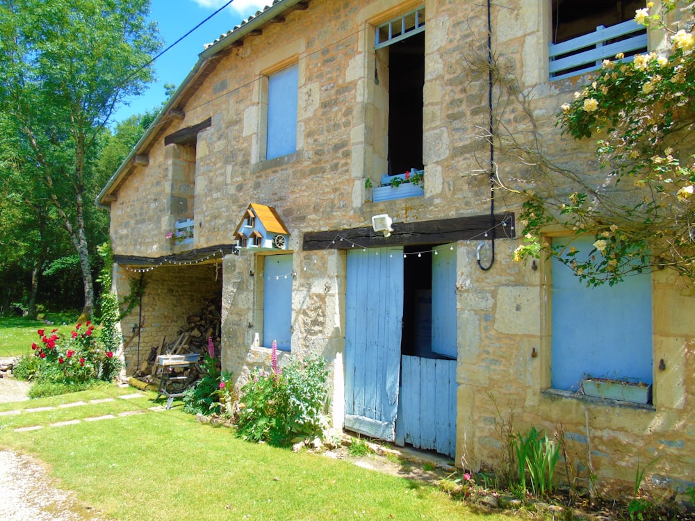 a run down house with blue doors