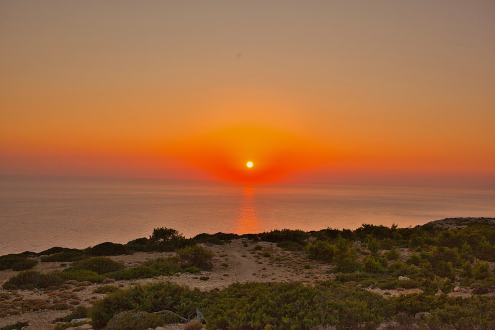 a sunset over a beach