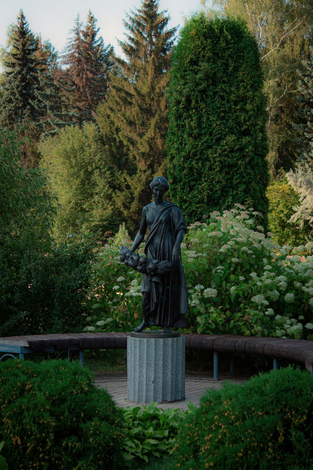 a statue of a person holding a gun