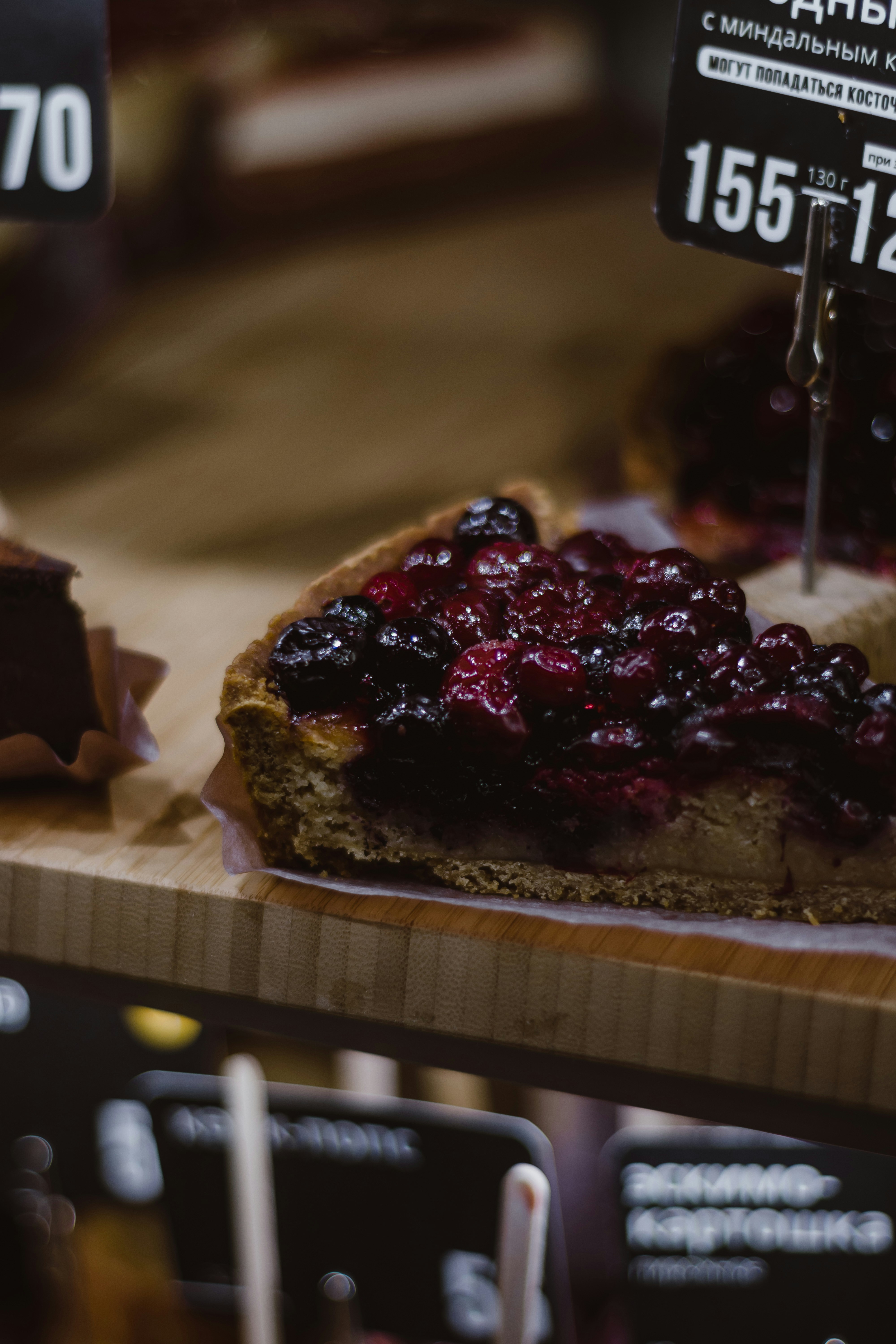 a cake with a red berry on top