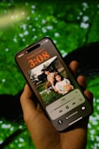 Close-up of a smartphone displaying a music player app.