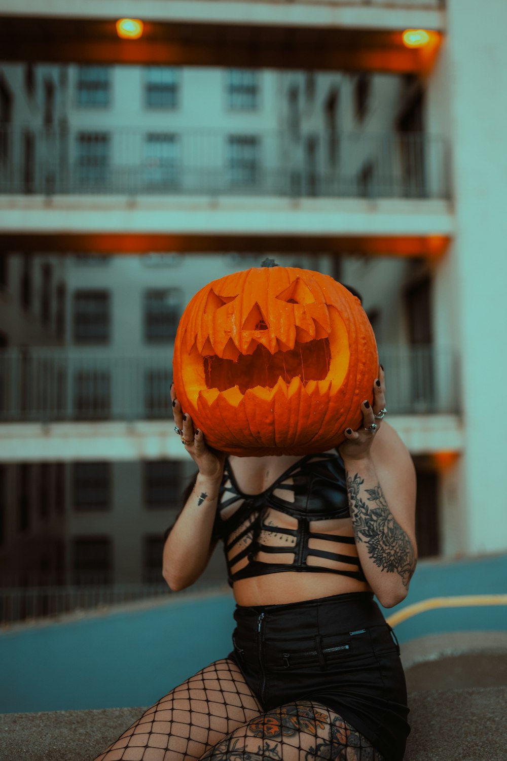 a person holding a pumpkin