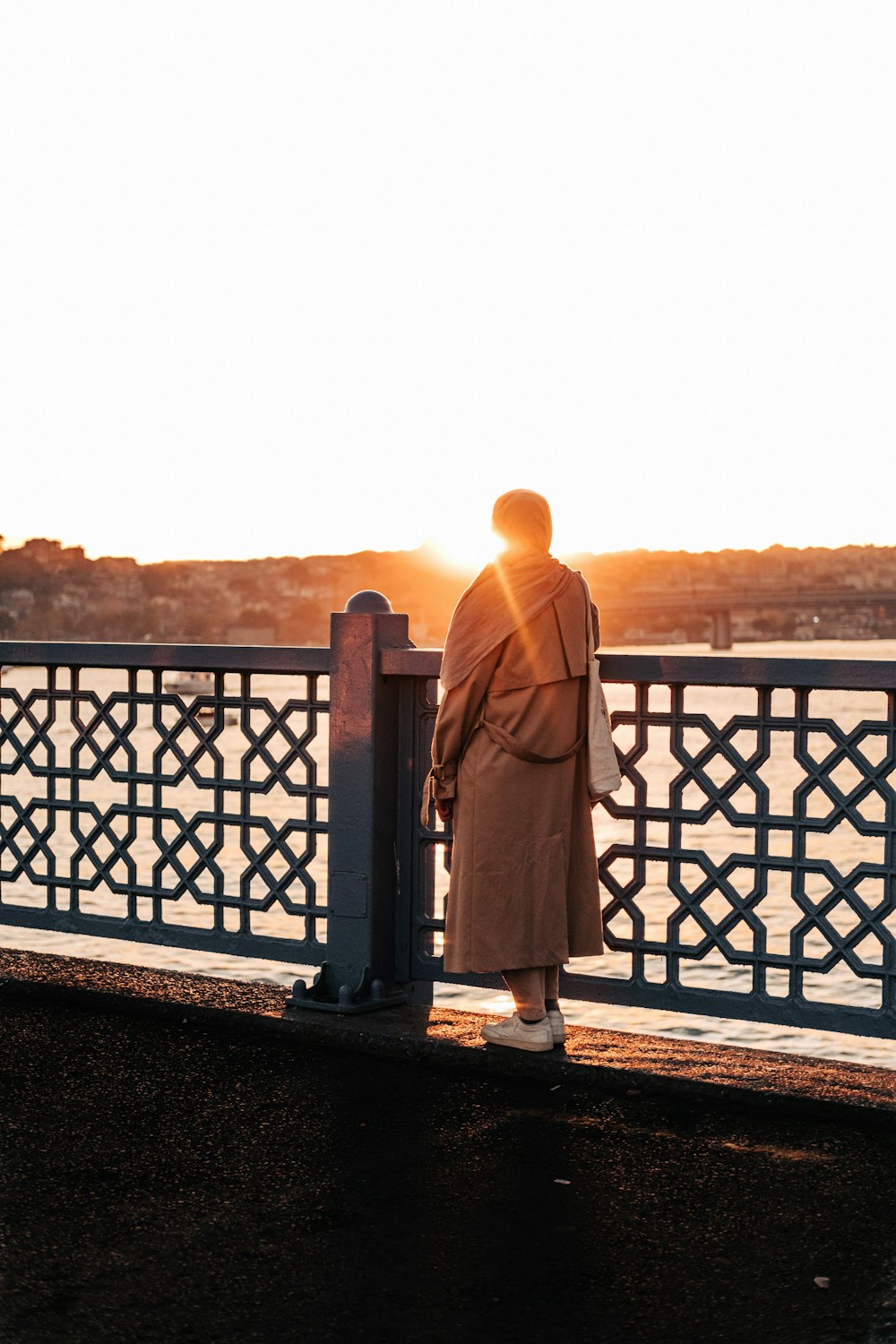 a person standing on a bridge