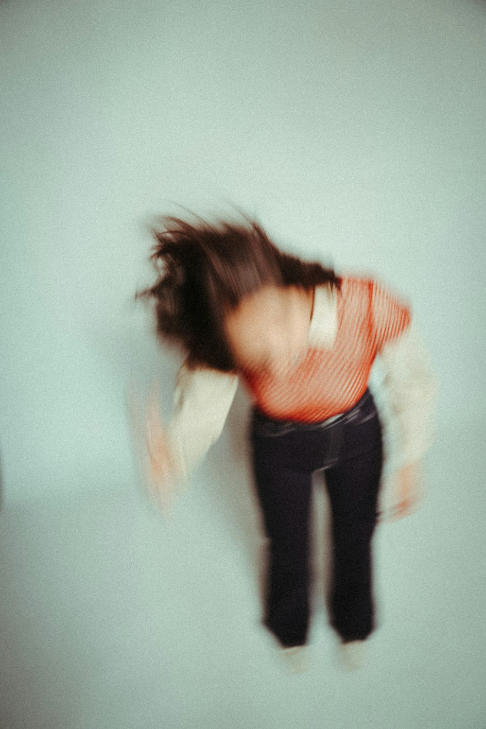 a person with the hair blowing in the wind