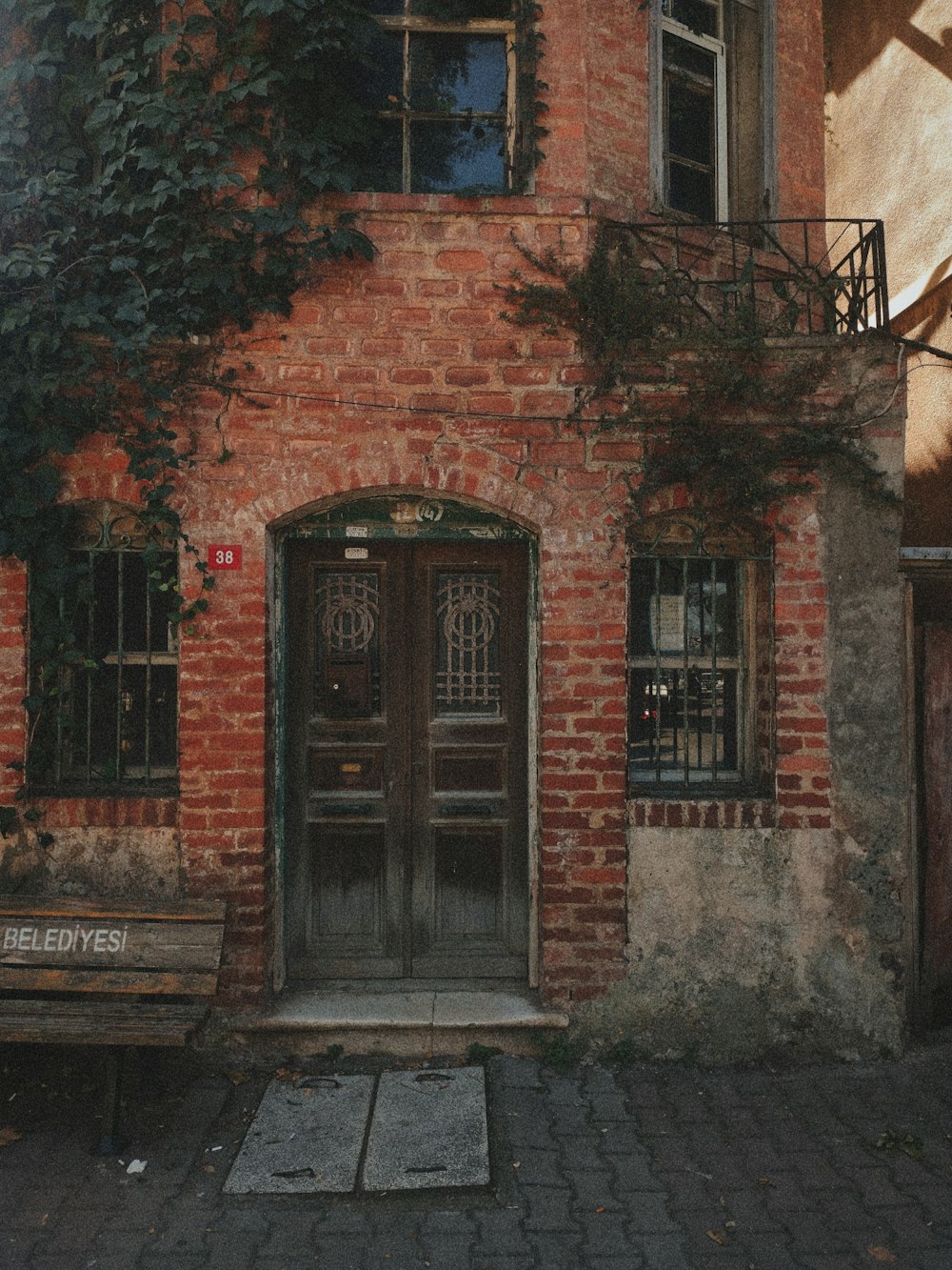 a brick building with a black door