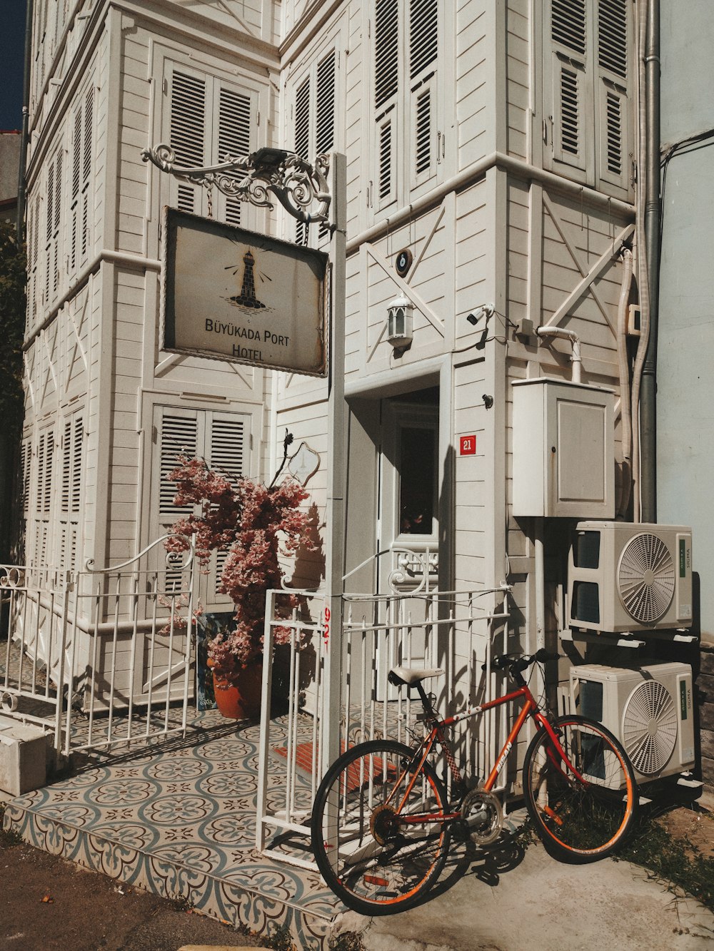 a bicycle parked in front of a white building