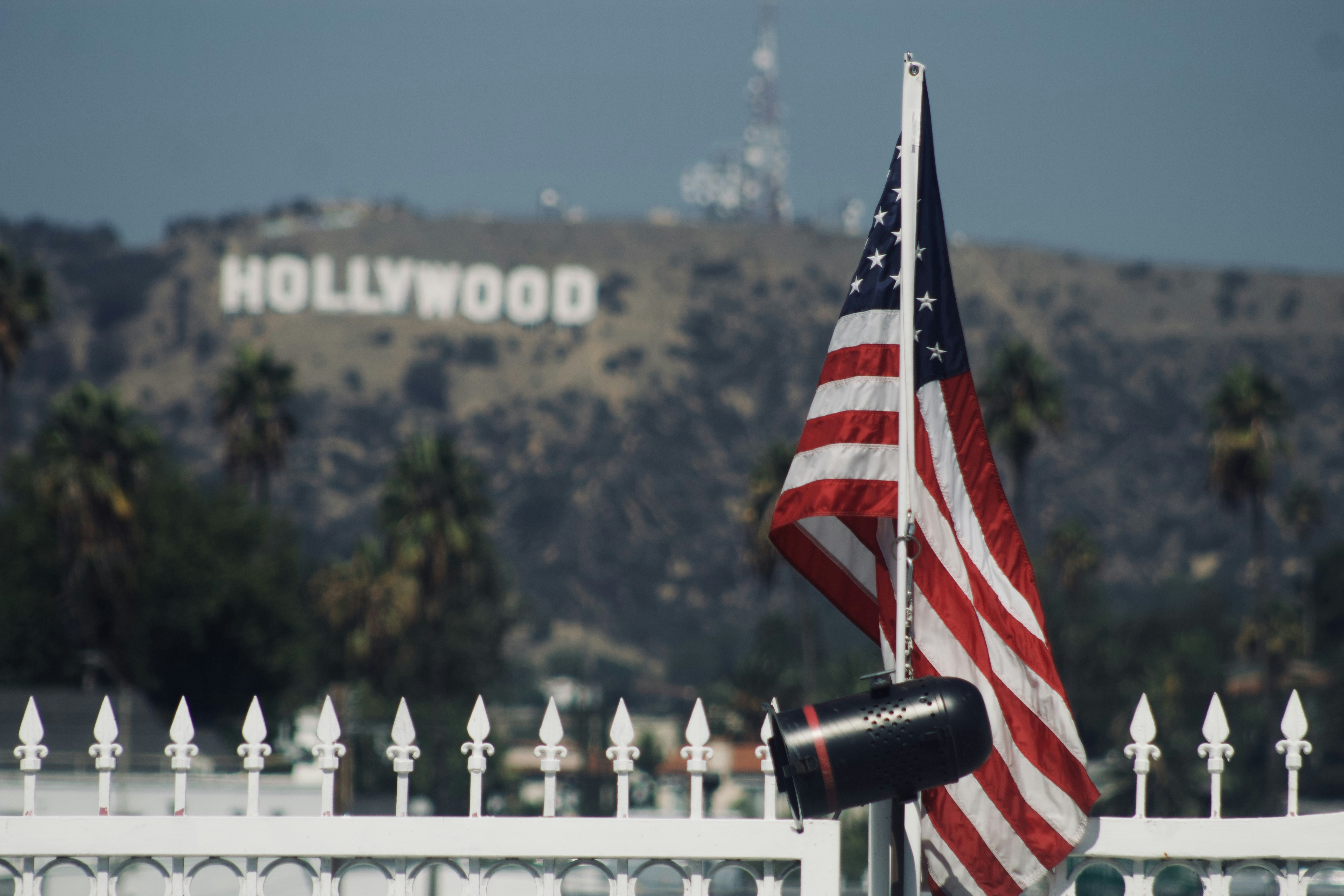 a flag on a white fence