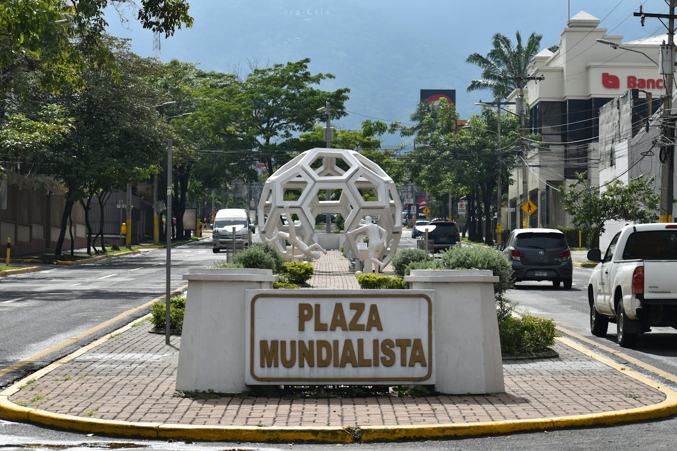 a large white sculpture in a city