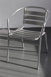 Sleek industrial metal furniture piece with brushed textures and minimalist design.