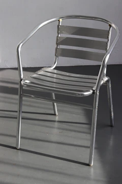 Sleek industrial metal furniture piece with brushed textures and minimalist design.
