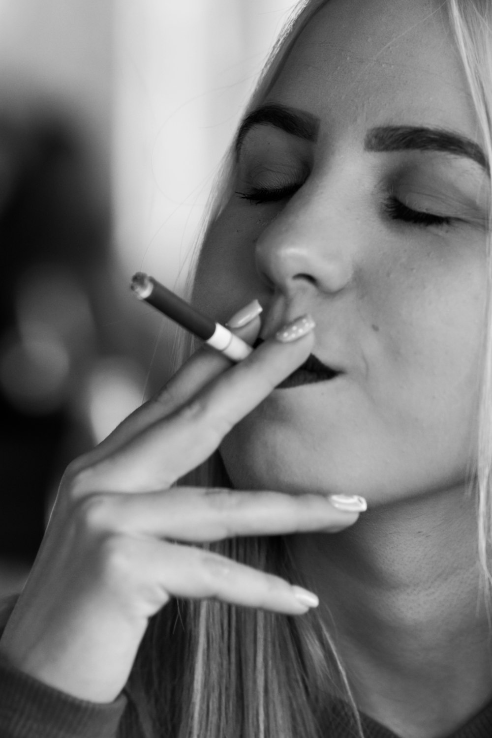 a woman smoking a cigarette