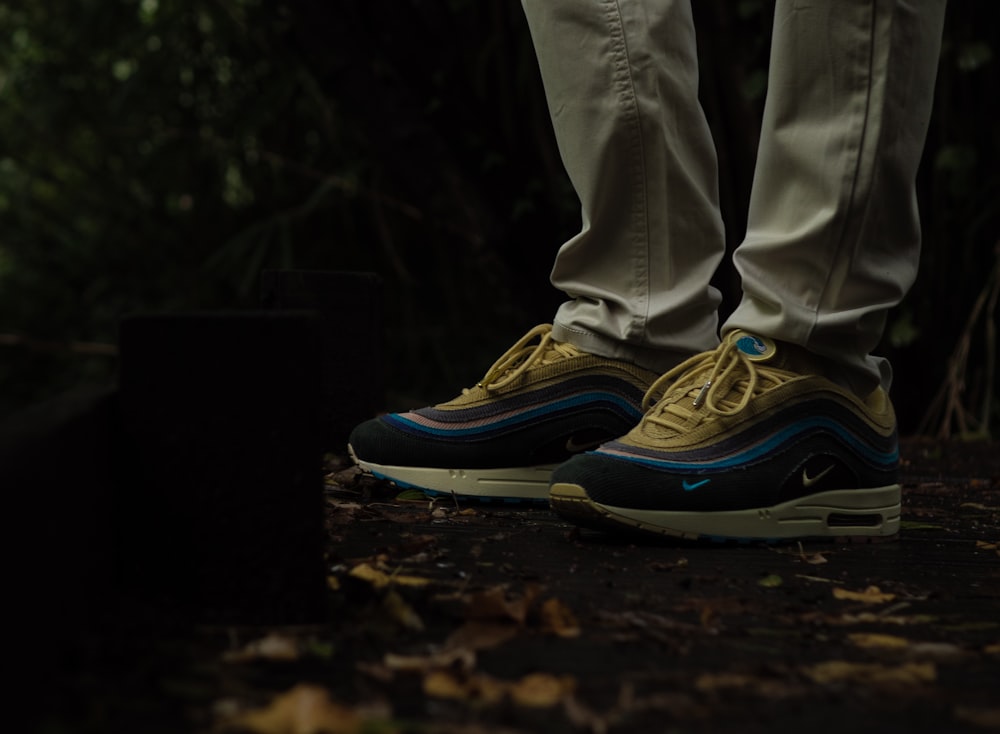 A person's legs wearing blue and yellow shoes photo – Free France Image on  Unsplash