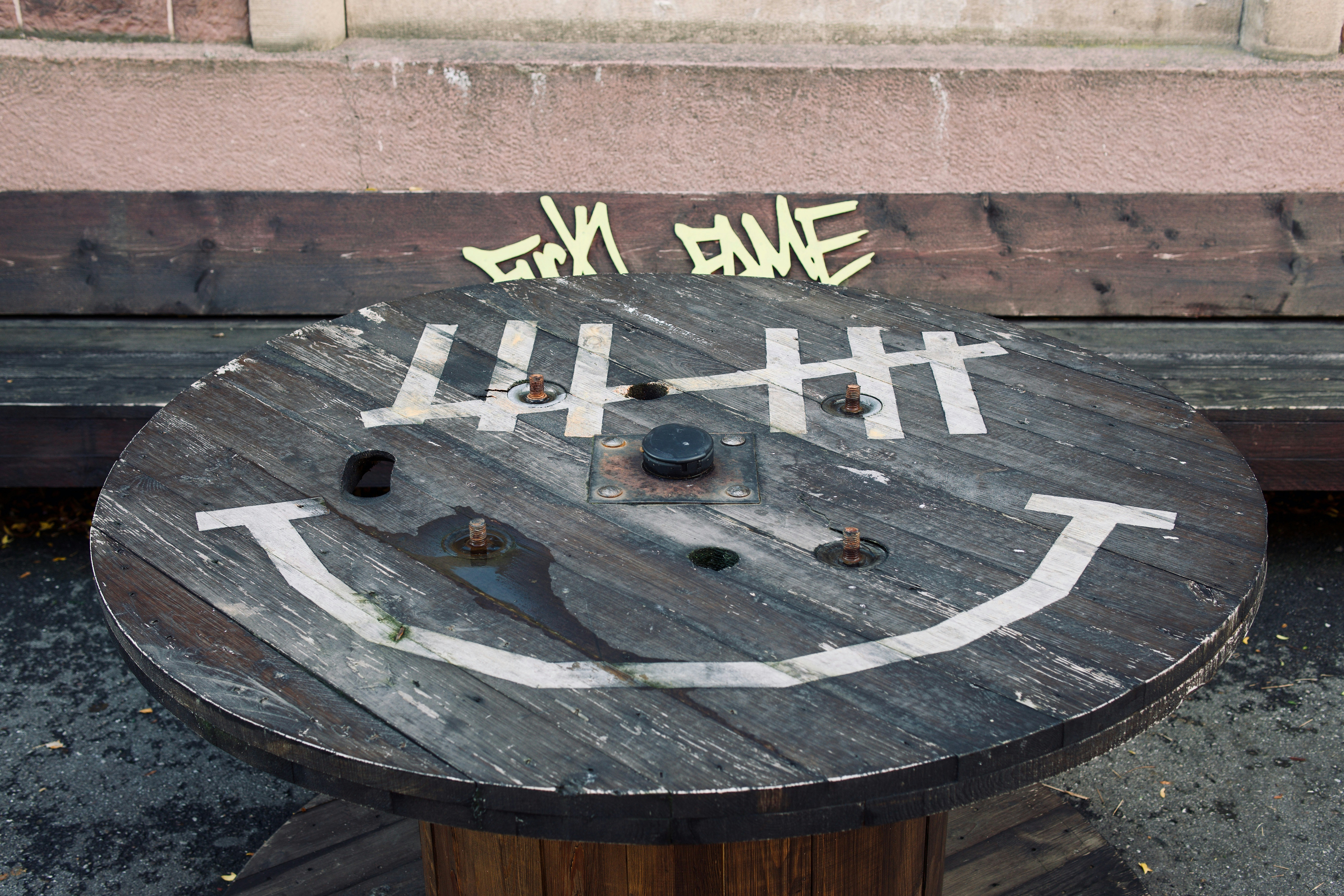 a sign on a wood surface