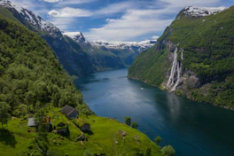 a river running through a valley between mountains
