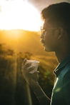 a man holding a can