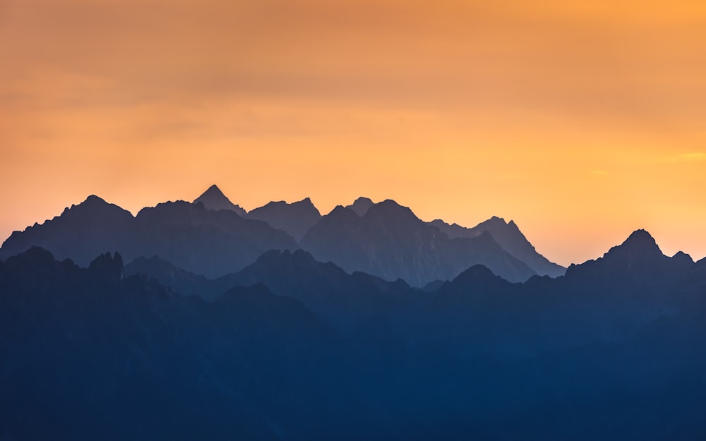 a mountain range with a sunset