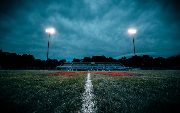 a field with a fountain in it