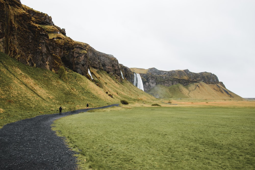 a path leading to a waterfall