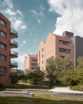 Modern residential apartment building with landscaped gardens.