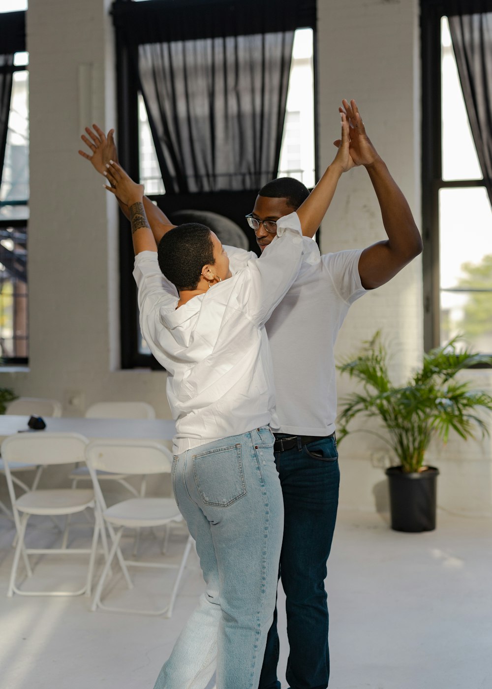 a person holding another man's hand up