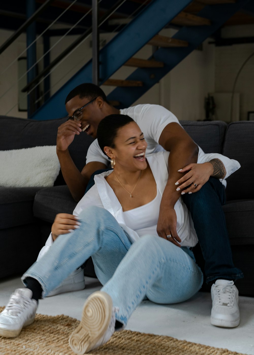 a man and woman sitting on a couch