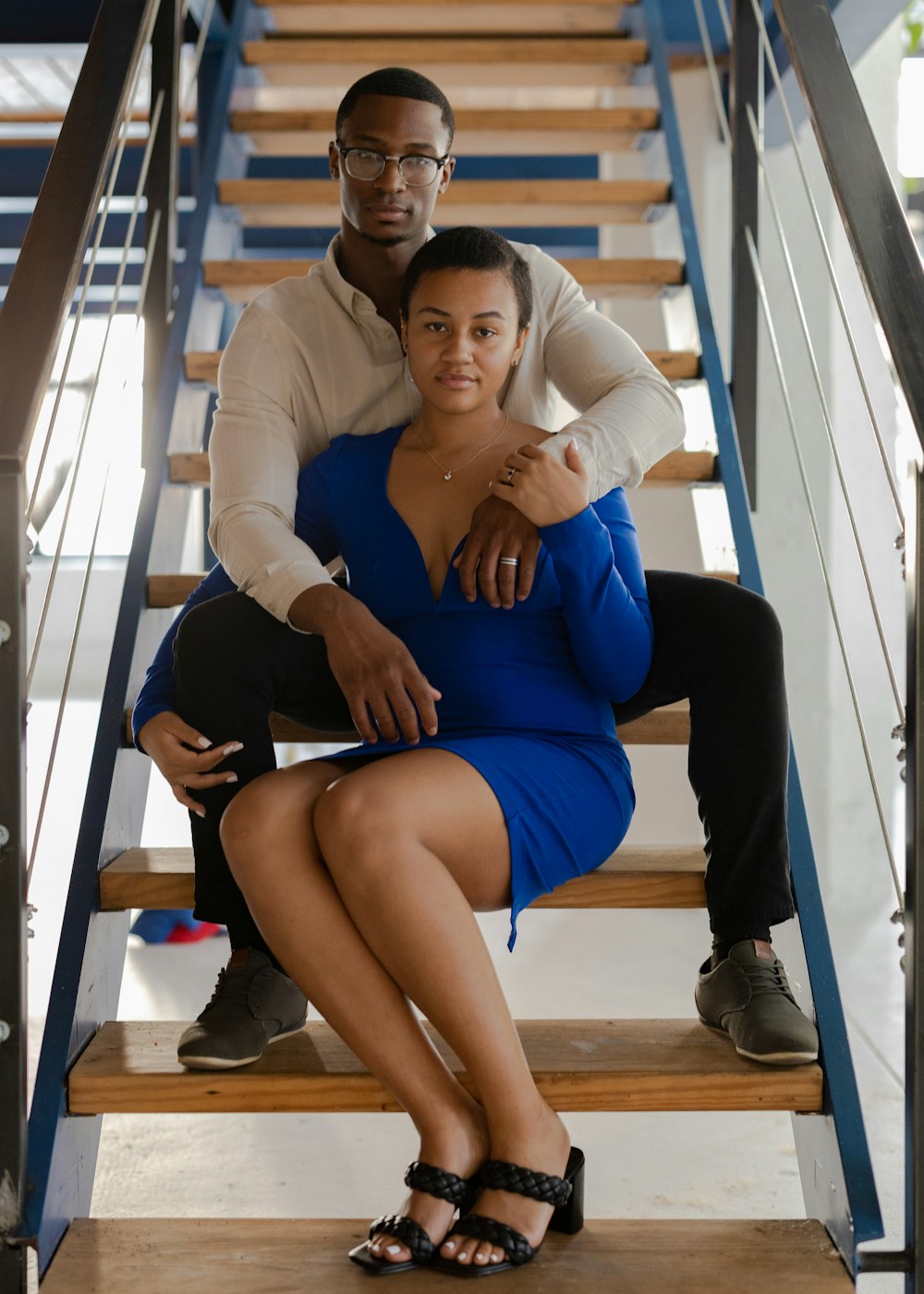 a man and woman sitting on a bench