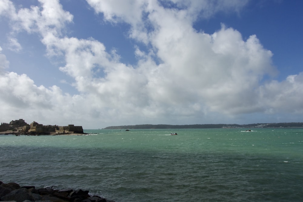 a body of water with a land in the distance