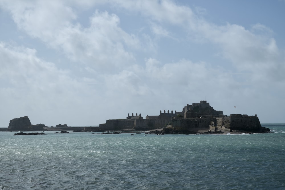 a large building on a rocky island