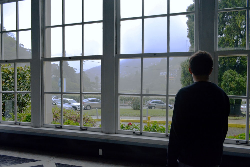 a person looking out a window