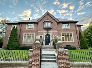 a brick house with a gate
