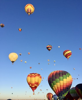 a group of hot air balloons in the sky