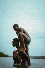a man holding a child in water