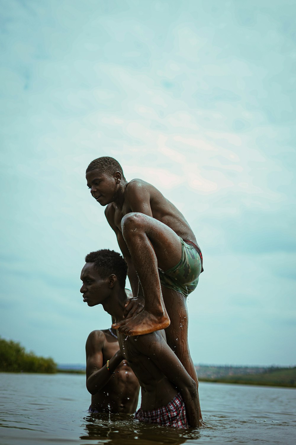 a man holding a child in water