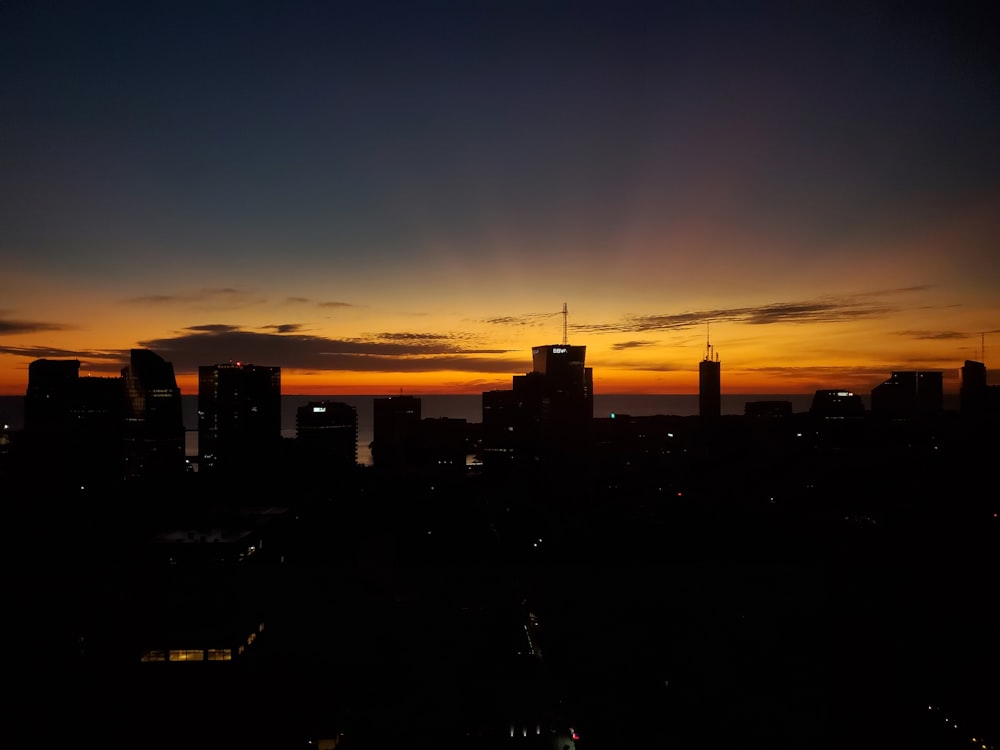 a city skyline at sunset