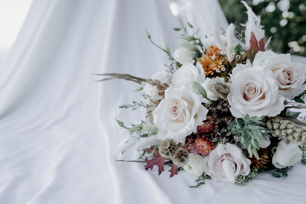 a bouquet of white and pink flowers