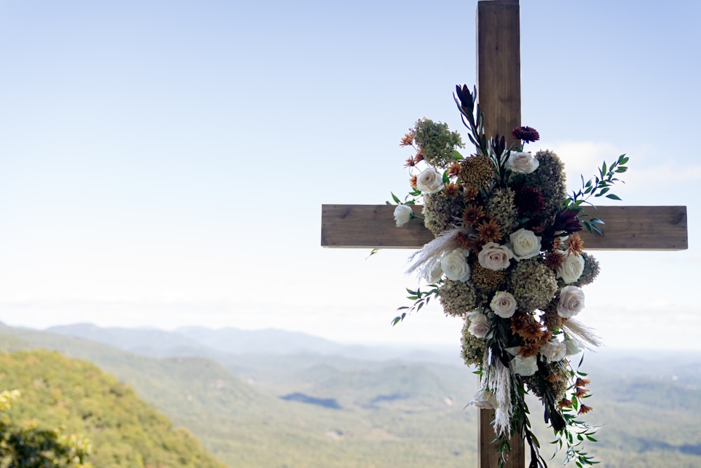 a cross with flowers on it